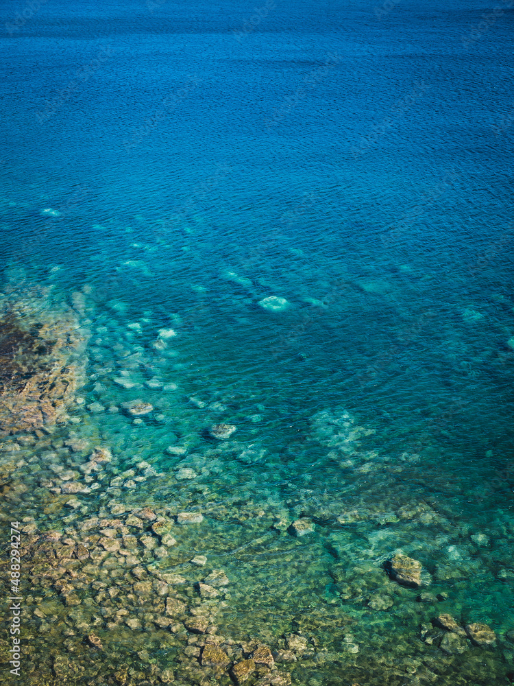 Sea surface with small waves, top view in blue and turquoise color tones