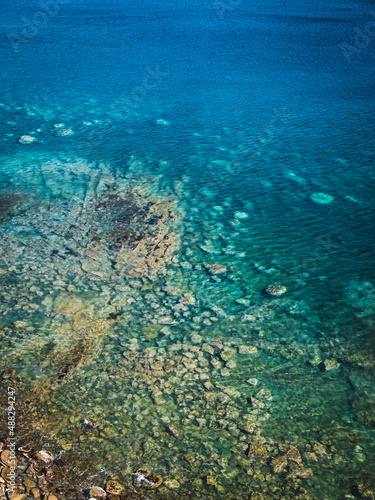 Fototapeta Naklejka Na Ścianę i Meble -  Sea surface with small waves, top view in blue and turquoise color tones