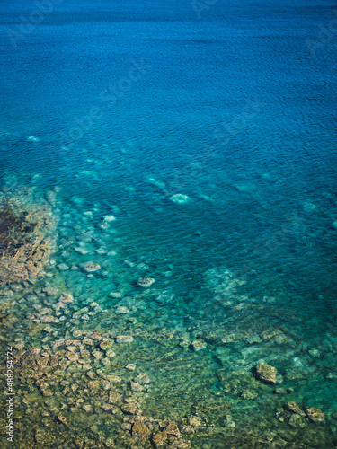 Sea surface with small waves, top view in blue and turquoise color tones