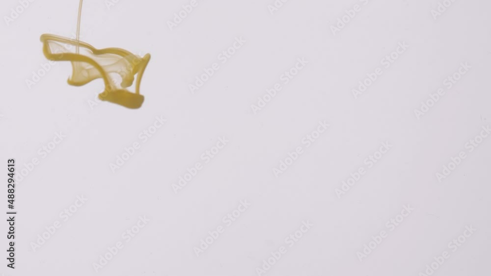 drop yellow ink paint in water slow motion 4k drop yellow ink paint in water slow motion 4k