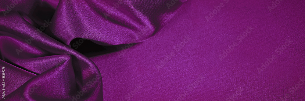Plum purple silk satin. Soft wavy pleats. Shiny fabric. Luxury background with copy space for design. Web banner. Valentine, anniversary, festive concept. Plum purple silk satin. Soft wavy pleats. Shiny fabric. Luxury background with copy space for design. Web banner. Valentine, anniversary, festive concept.