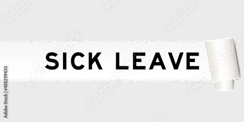 Ripped gray paper background that have word sick leave under torn part