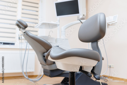 Modern stylish bright dental office with a new chair for receiving patients. selective focus © Дмитрий Ткачук
