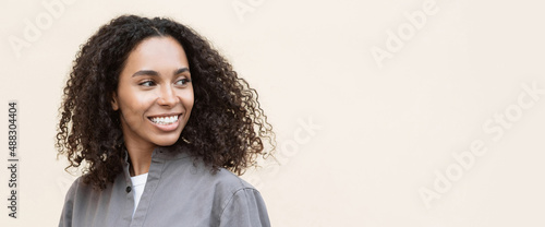 Closeup portrait of beautiful smiling young woman. Laughing joyful cheerful girl isolated studio shot. Panoramic banner
