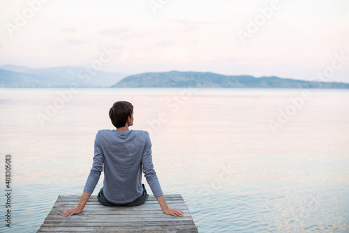 Photography Man looking at the sea enjoying life, Summer fun, leisure, relaxation, vacations