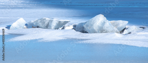 Texture of winter ice surface. Blue natural ice background. Farnebofjarden national park in north of sweden.