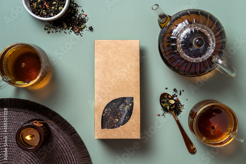 Organic tea branding and packaging mockup. Blank tea packaging mockup with tea. Kraft paper pack with window and empty space to display your branding design.