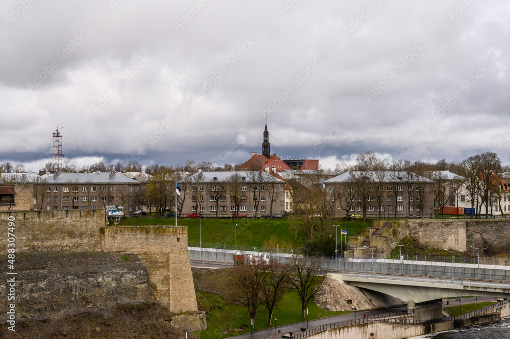 View from the fortress wall to Narva and the bridge that connects Russia and Estonia. State border. Ivangorod fortress. Historical sites.