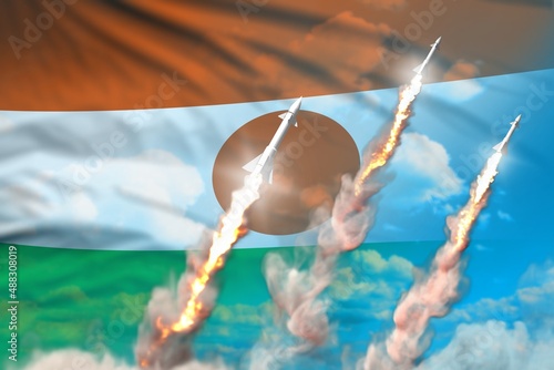 Niger nuclear missile launch - modern strategic nuclear rocket weapons concept on blue sky background, military industrial 3D illustration with flag photo