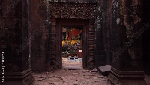 Champassak / Laos - Feb 13: Vat Phou – ruined Khmer Hindu Mountain Temple. Buddhist altar buddha statues. Holy place for prayer. Buddhism religion. UNESCO World Heritage. Ancient temple complex. Slow