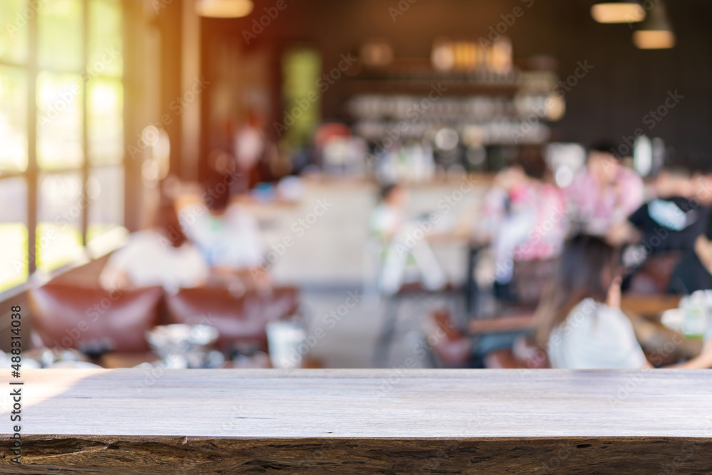 Empty wooden table space platform and blurry defocused restaurant interior and coffee shop Empty wooden table space platform and blurry defocused restaurant interior and coffee shop