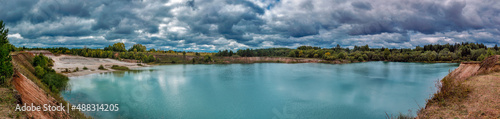 lake in the limestone quarry on a cloudy gloomy summer day
