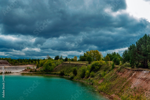 lake in the limestone quarry on a cloudy gloomy summer day