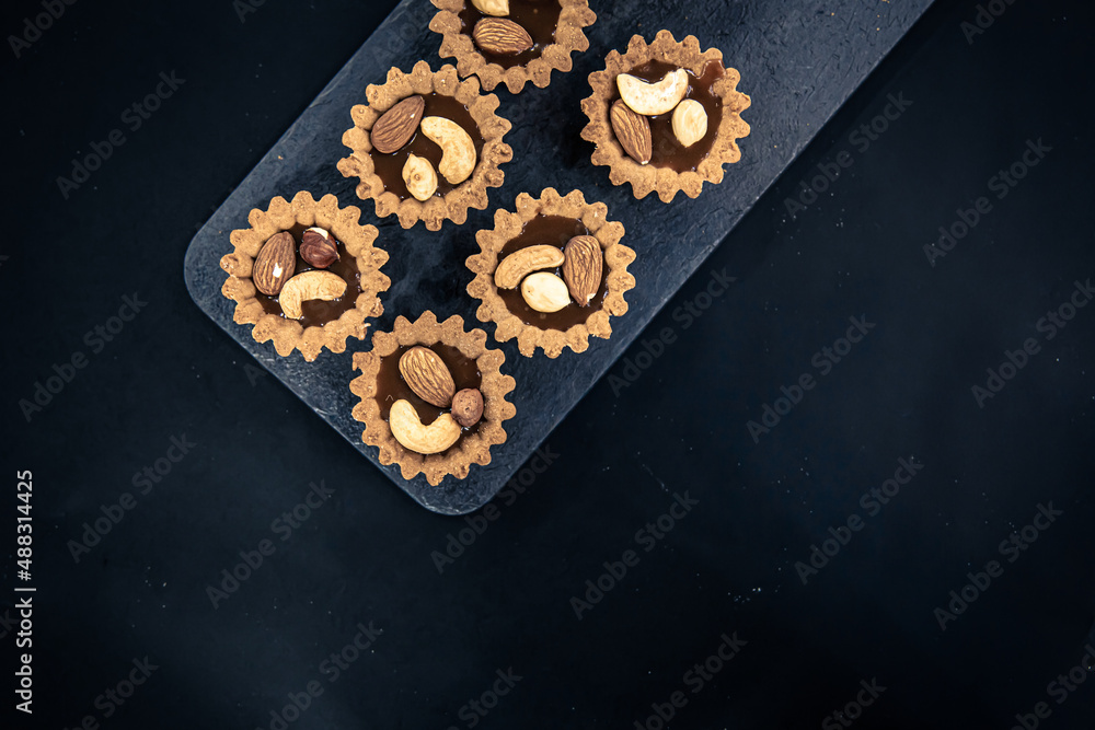 Close-up of cookies in the form of baskets with nut filling. Close-up of cookies in the form of baskets with nut filling.