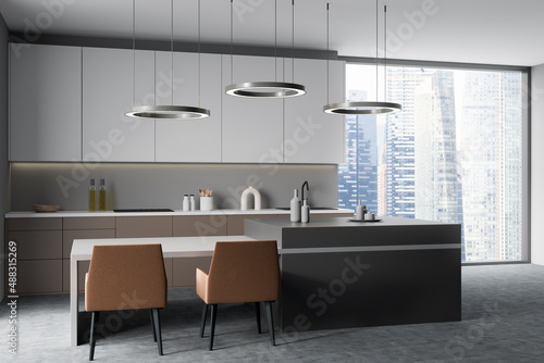 Modern kitchen interior with table and seats, shelves and panoramic window © ImageFlow