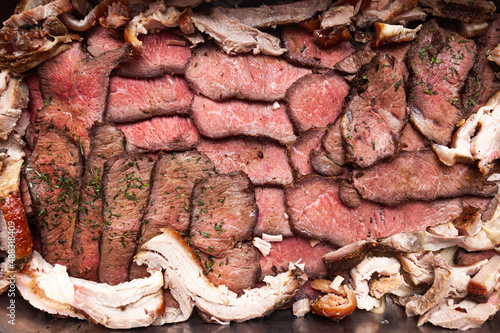 Tableau sur toile Baked and sliced pork, beef and lamb meat, top view