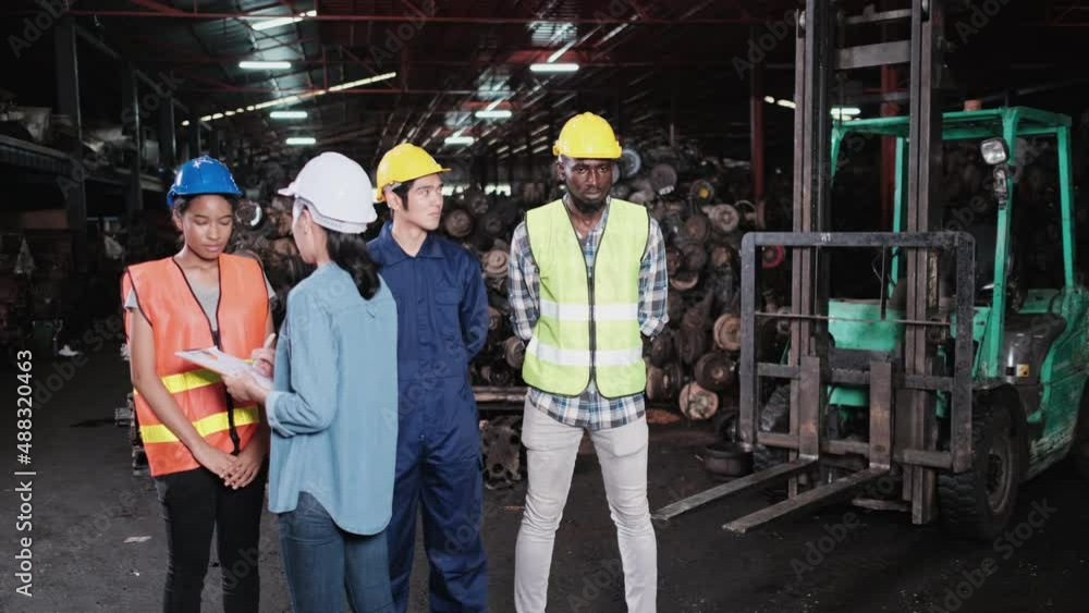 Angry manager woman dissatisfied and scolding employee for bad work one by one in the automotive spare part warehouse factory. Worker or employee stressed on work from blames. Unsuccessful job on duty Angry manager woman dissatisfied and scolding employee for bad work one by one in the automotive spare part warehouse factory. Worker or employee stressed on work from blames. Unsuccessful job on duty