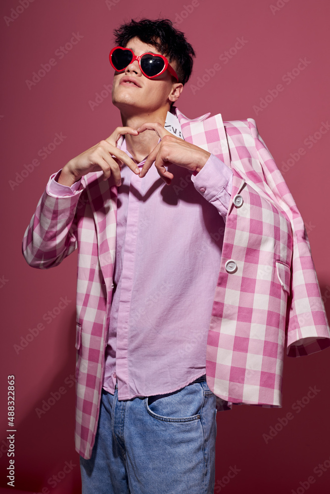 Obraz premium handsome guy self confidence pink plaid blazer fashion posing pink background unaltered