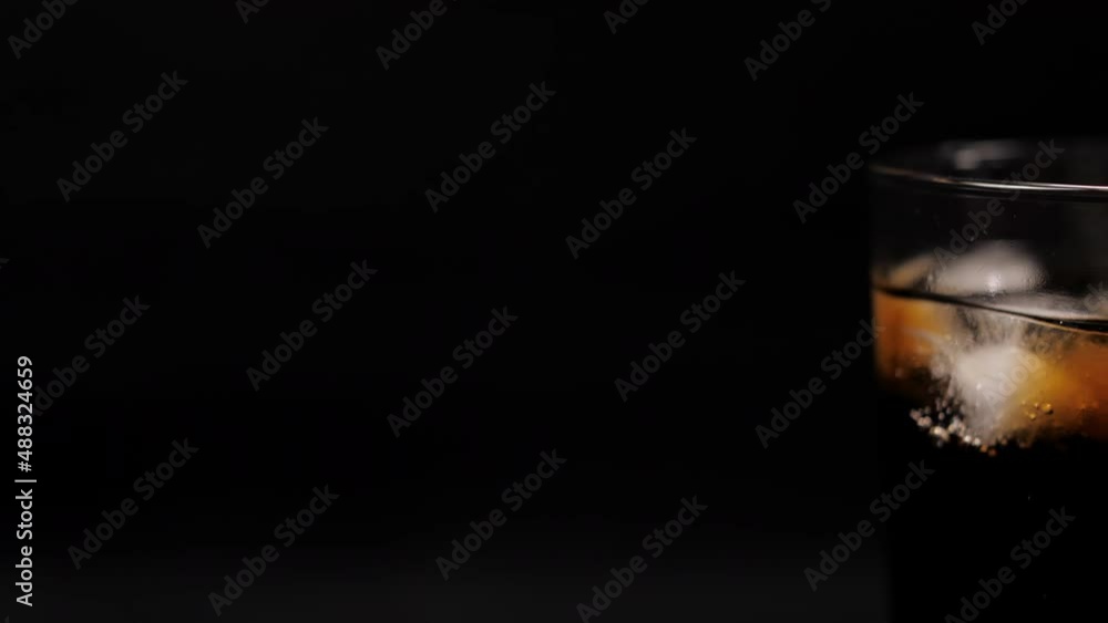 cola coke with ice cubes on cold glass slow motion 4k cola coke with ice cubes on cold glass slow motion 4k