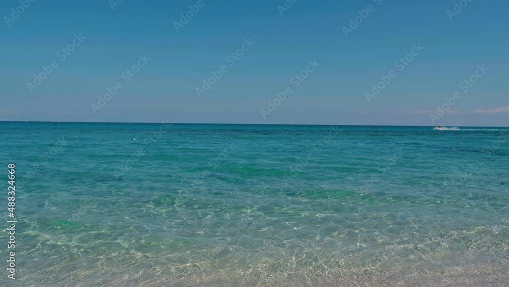 Aerial view of crystal clear sea and white sand beach. Looping Water surface texture, Top view ocean waves slow motion, Sea side white sand, Sun shine water seamles loop background. Aerial view of crystal clear sea and white sand beach. Looping Water surface texture, Top view ocean waves slow motion, Sea side white sand, Sun shine water seamles loop background.