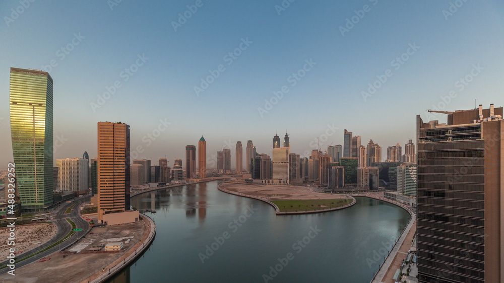 Obraz premium Cityscape skyscrapers of Dubai Business Bay with water canal aerial timelapse.