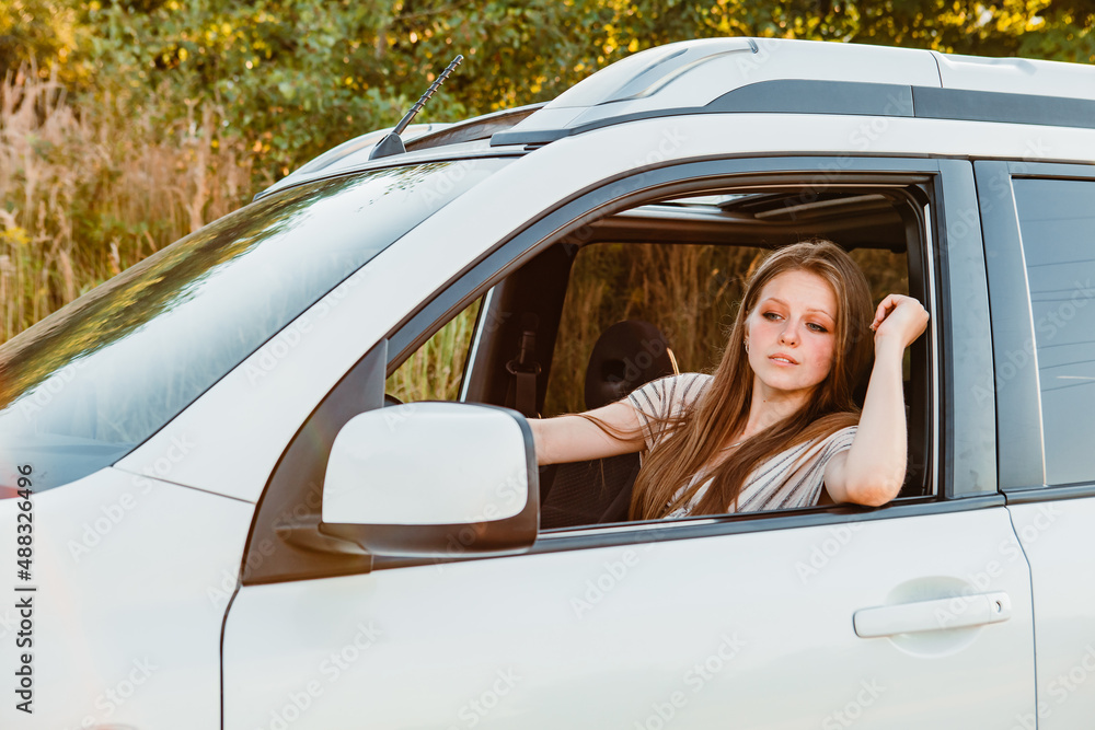 young pretty woman driving car on sunset young pretty woman driving car on sunset
