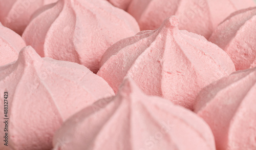 Obraz na płótnie Airy pink meringue close-up. Selective focus. Background.