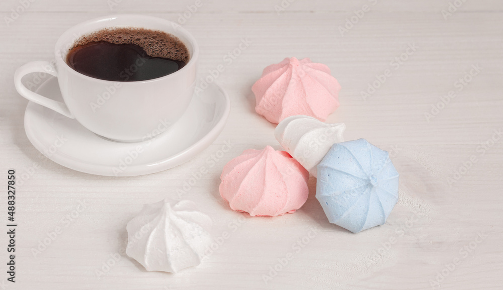 Air meringue and a cup of black coffee. Place to copy. Air meringue and a cup of black coffee. Place to copy.