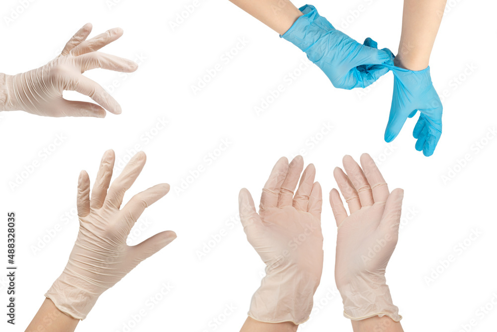 Woman puts on white rubber gloves. Woman puts on white rubber gloves.