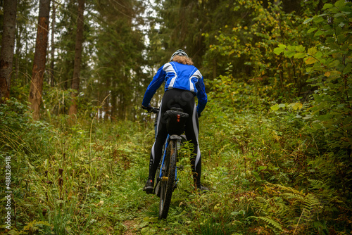 Bicyclist in the forest, Russia