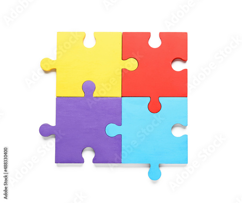 Colorful puzzle pieces on white background. Concept of autistic disorder