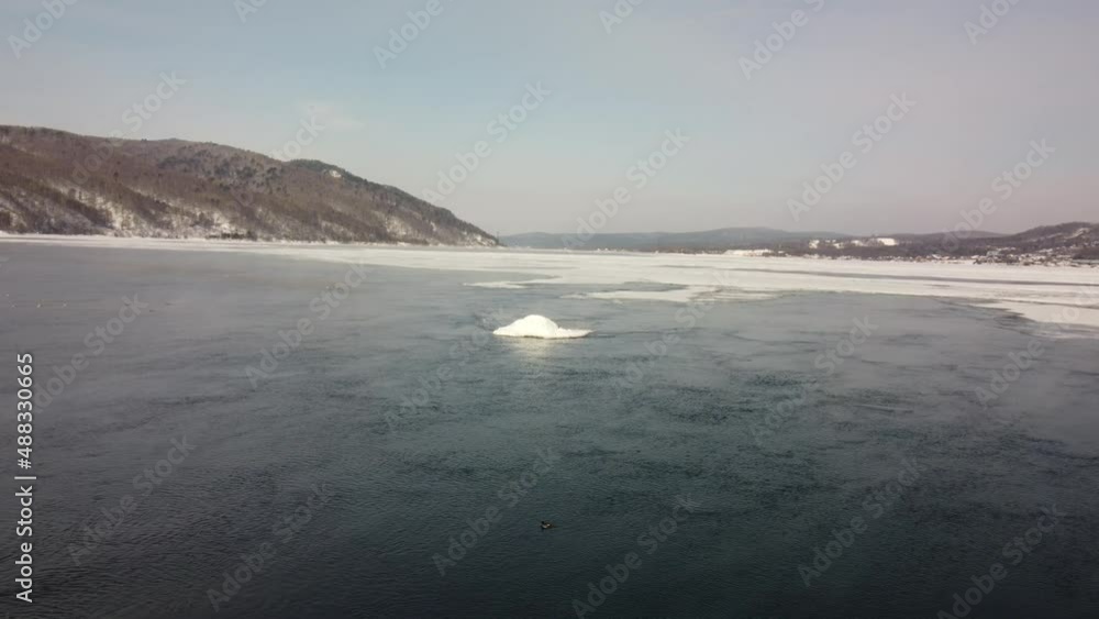 Frozen shaman stone on Lake Baikal Frozen shaman stone on Lake Baikal