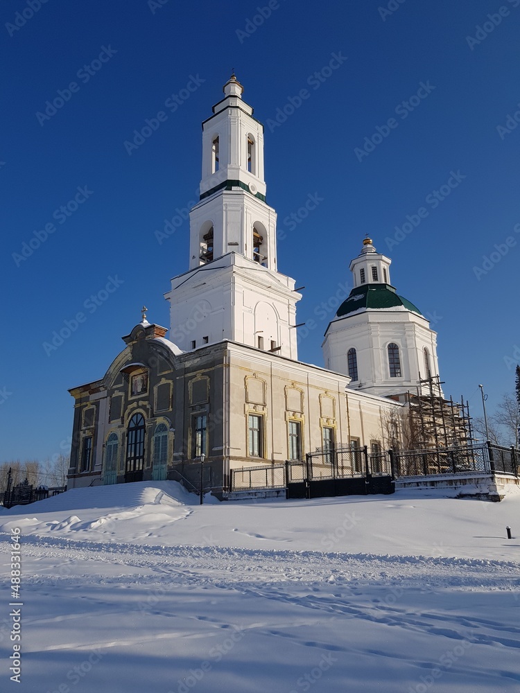 Christian church in a snowy field