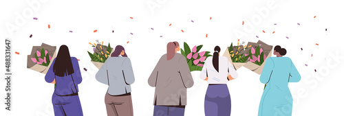 mix race girls walking with flowers bouquets in park 8 march international happy womens day celebration concept