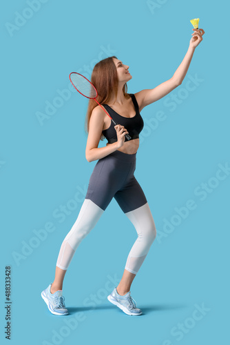 Sporty female badminton pla...