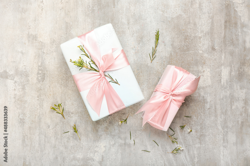 Beautiful spring composition with flowers and gift boxes on grunge background Beautiful spring composition with flowers and gift boxes on grunge background