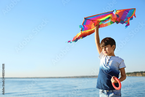 Cute little boy with kite n...