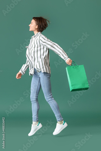 Jumping young woman with sh...