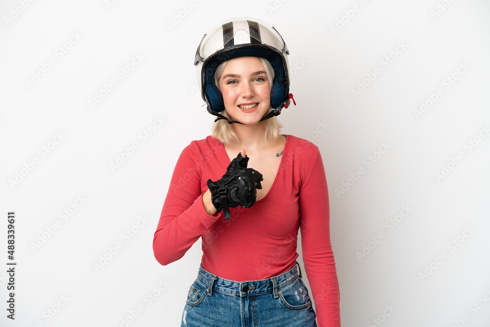 Young caucasian woman with a motorcycle helmet isolated on white background giving a thumbs up gesture Young caucasian woman with a motorcycle helmet isolated on white background giving a thumbs up gesture