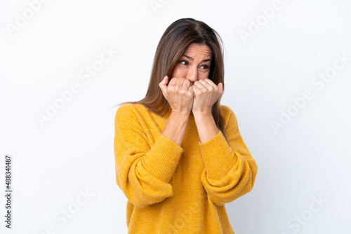 Quadro su tela Middle age caucasian woman isolated on white background nervous and scared putti