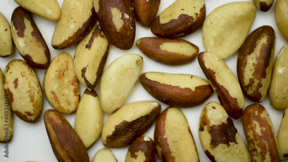 Rotating closeup top view of brazil nuts.