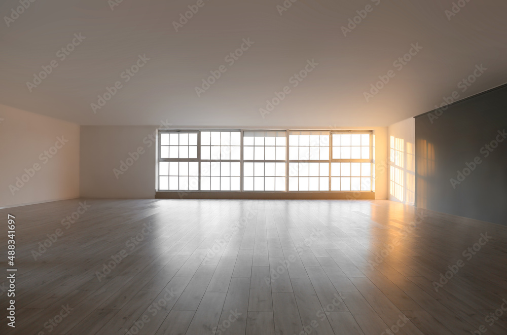 View of empty room with big windows and shelves View of empty room with big windows and shelves