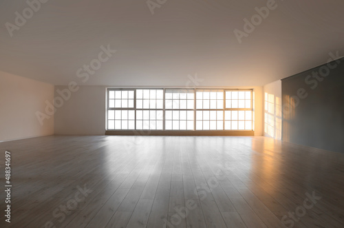 View of empty room with big windows and shelves