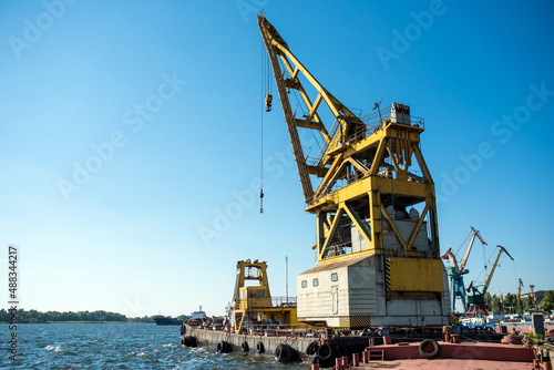 Floating crane moored at the shipyard