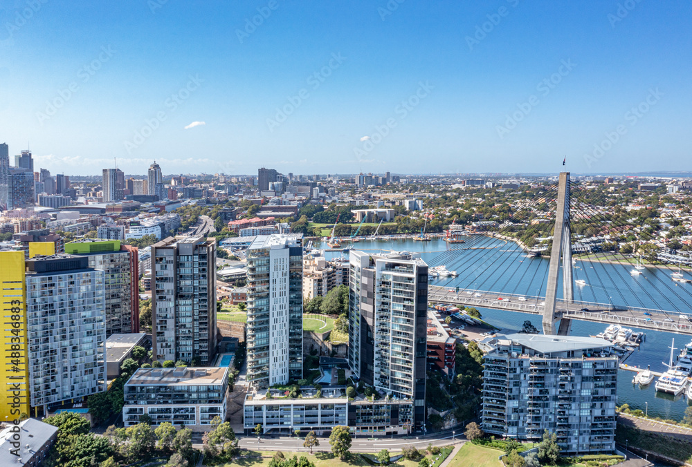 Aerial drone view of Anzac Bridge looking toward Pyrmont in Sydney, Australia on a sunny morning   