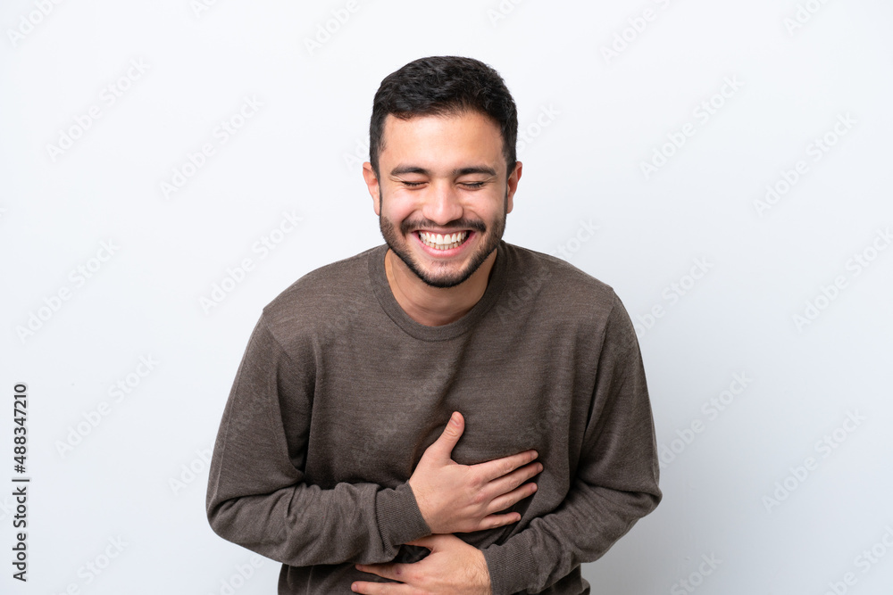 Young Brazilian man isolated on white background smiling a lot Young Brazilian man isolated on white background smiling a lot