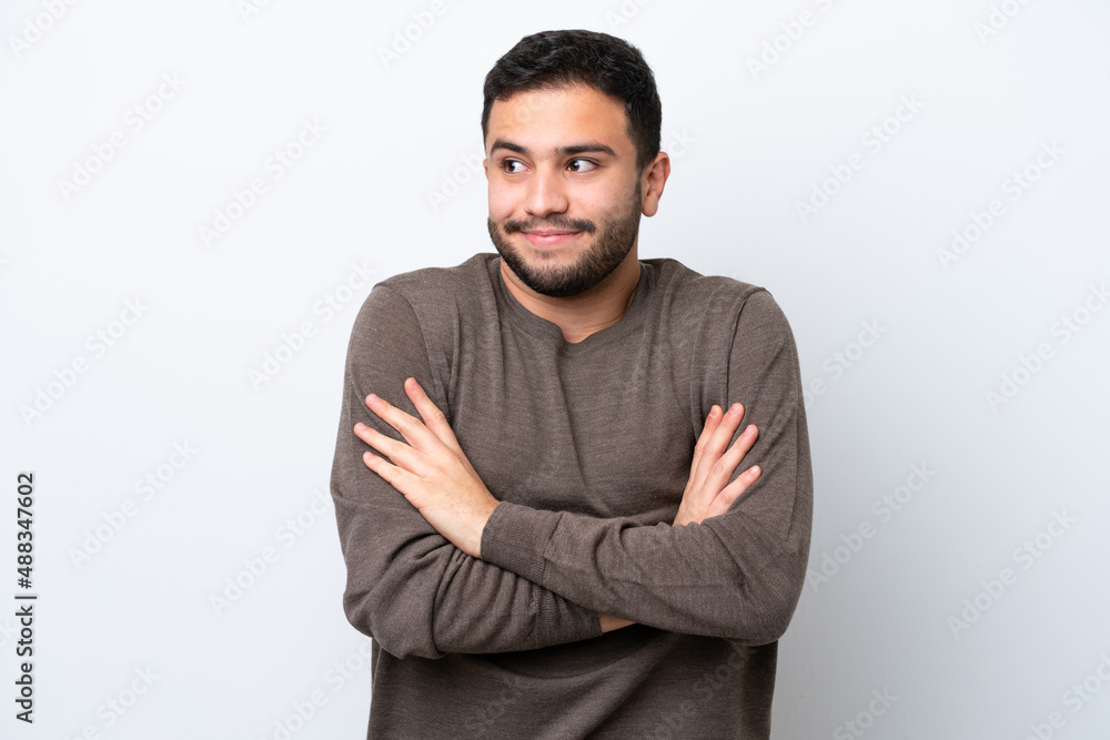 Young Brazilian man isolated on white background making doubts gesture while lifting the shoulders Young Brazilian man isolated on white background making doubts gesture while lifting the shoulders
