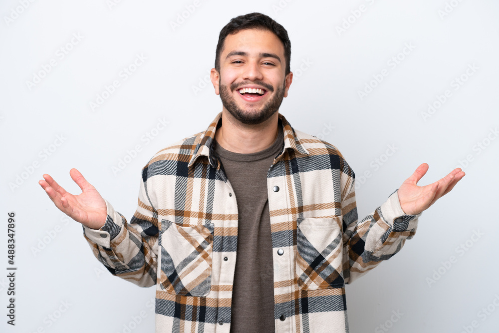 Young Brazilian man isolated on white background smiling a lot Young Brazilian man isolated on white background smiling a lot