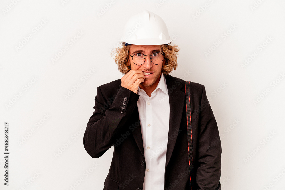 Young architect caucasian man with helmet isolated on white background biting fingernails, nervous and very anxious. Young architect caucasian man with helmet isolated on white background biting fingernails, nervous and very anxious.