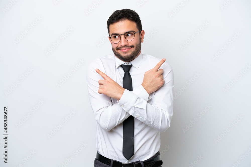 Business Brazilian man isolated on white background pointing to the laterals having doubts Business Brazilian man isolated on white background pointing to the laterals having doubts